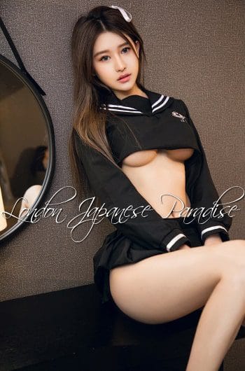 VImiko Asian Escort in Oxford Street in school outfit showing her breasts