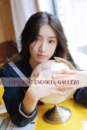 Dada Sexy Asian Escort in Mayfair in front of a globe