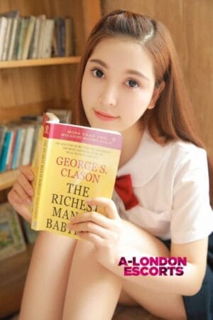 Gloria Korean Bond Street Escort reading a book