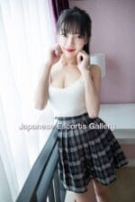 Vivi Small Teen Asian Escort poses in her bedroom