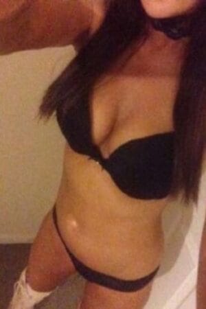 close up of Birmingham escorts tanned breasts