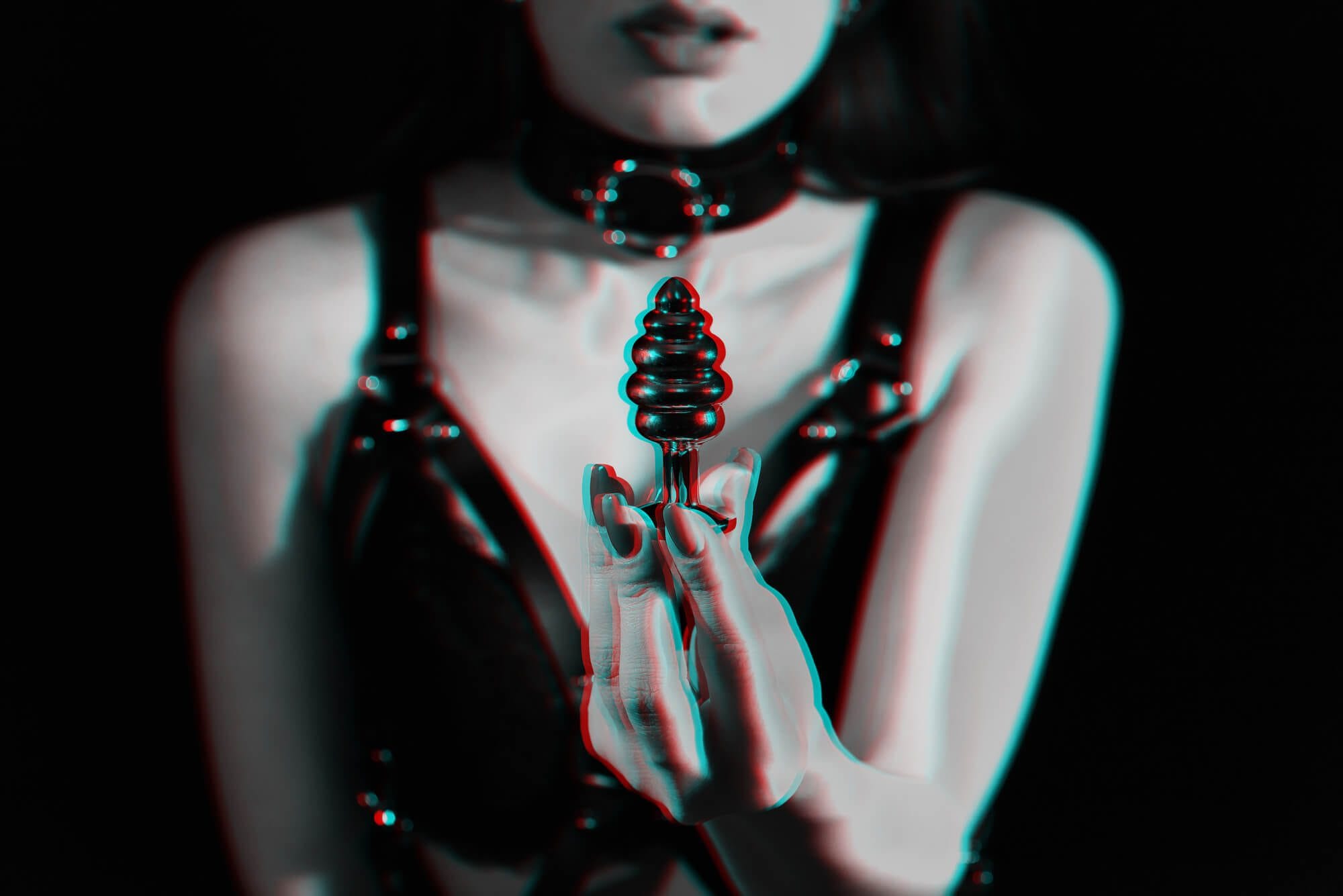 women in 3d holding a butt plug