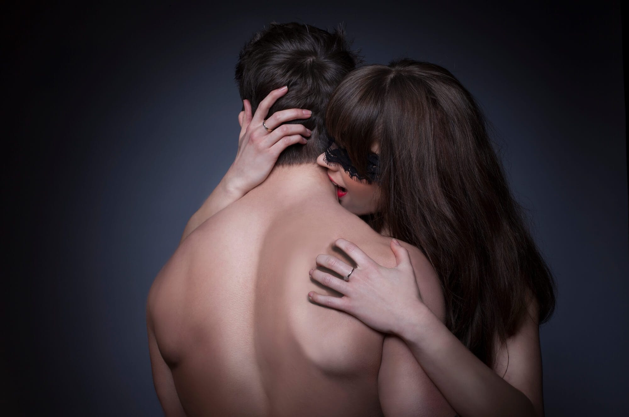 woman biting mans neck