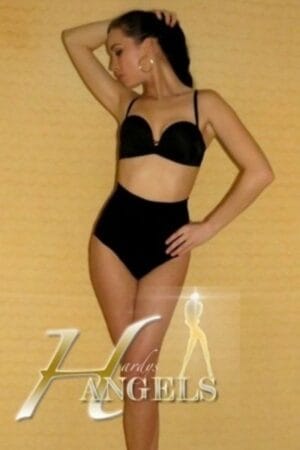 Bournemouth escort poses in black underwear