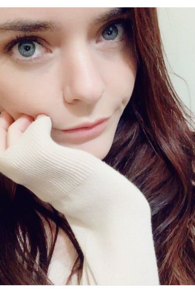 young Manchester escort with her hand on her face