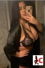 busty Belfast escort takes a selfie in the mirror