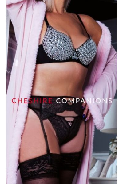 mature Liverpool Escort in pink gown and lingerie
