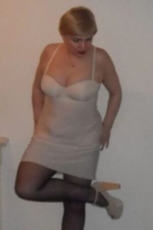 mature blonde Plymouth escort in black stockings and high heels