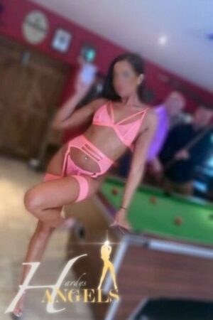 Southampton escort in pink underwear poses by a pool table
