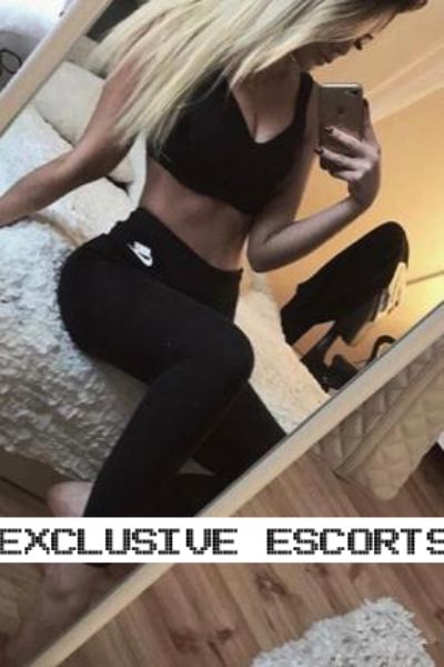 sporty Essex escort takes a selfie on the bed