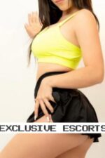 Essex escort in lime green top and black short skirt