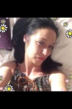 Mature Peterborough escort laid on her bed