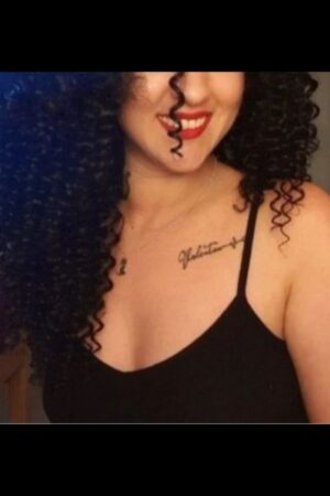 smiling Carlisle escort in red lipstick