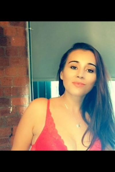 smiling Bradford escort in lingerie