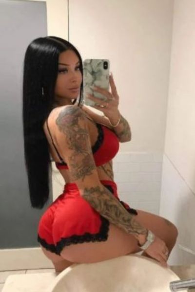 tattooed Derby escort takes a selfie in the bathroom