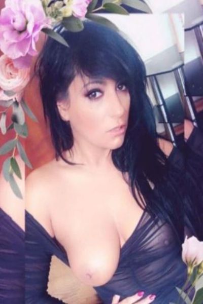 one breast out for Halifax escort with dark hair