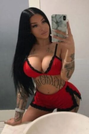 tattooed and busty Derby escort takes a selfie