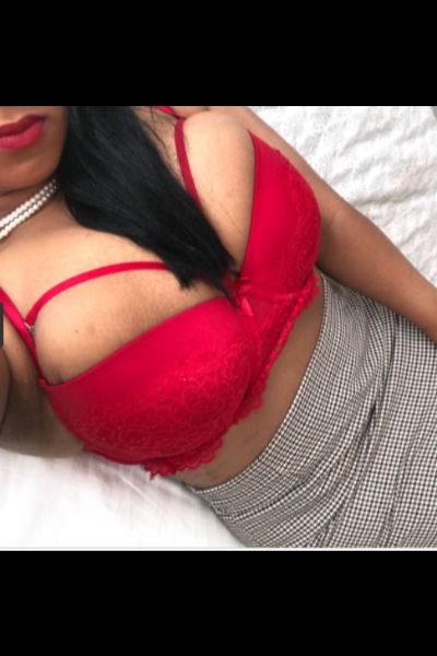 busty full figured Chelmsford escort in red bra