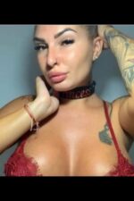 blonde tattooed Canterbury escort in a red bra