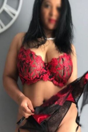 Chelmsford escort in black bra with red accents
