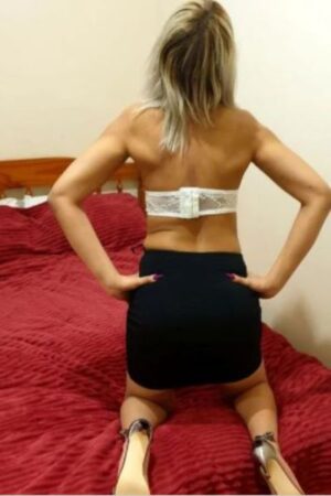 rear view of blonde Blackpool escort in skirt