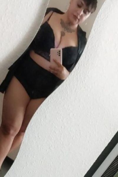 Curvy Blackpool escort with a neck tattoo