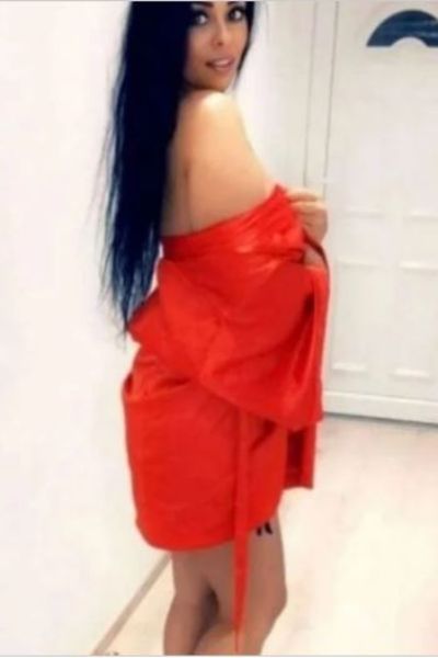 long black haired Blackburn escort in red robe
