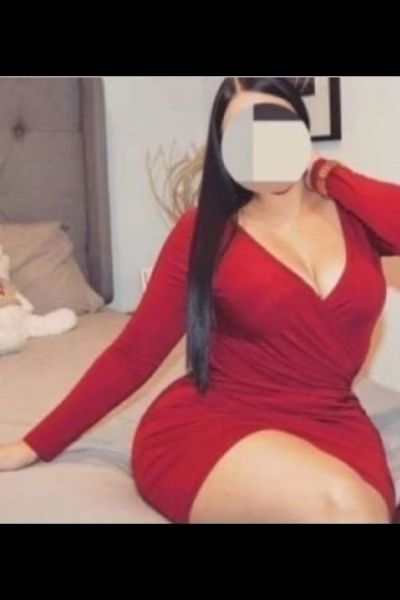 full figured Leeds escort in a red dress