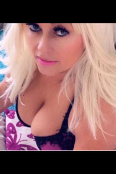 mature blonde Leeds escort giving the camera sexy eyes