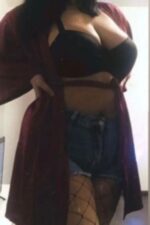 robed Blackburn escort showing cleavage