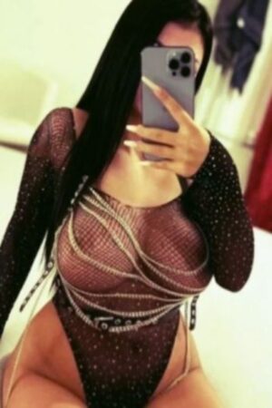 dark haired Huddersfield escort in a sheer top
