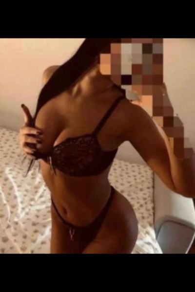 tanned and busty Milton Keynes escort