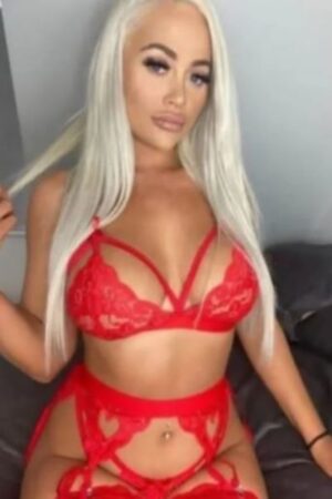 blonde Norwich escort made up in red sexy lingerie