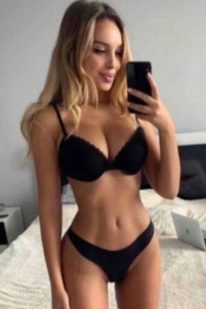 busty petite Leeds escort takes a selfie