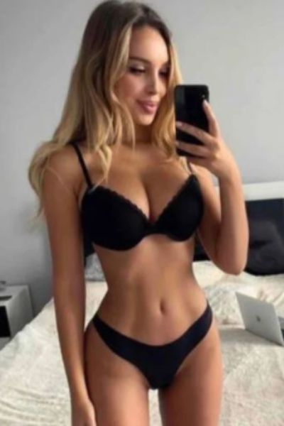 busty petite Leeds escort takes a selfie