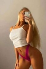 blonde Middlesbrough escort in a pink thong taking a selfie