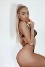 blonde Middlesbrough escort eating provocatively