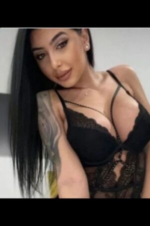 dark haired exotic Portsmouth escort with a shoulder tattoo