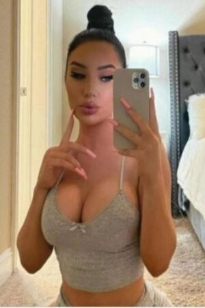 cute Oxford escort with big tits taking a selfie