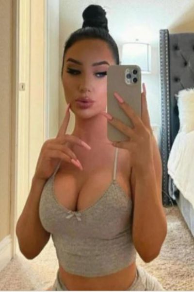 cute Oxford escort with big tits taking a selfie