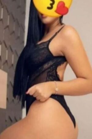 long dark haired escort posing