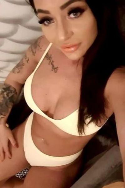 tattooed Walsall escort in yellow swimwear