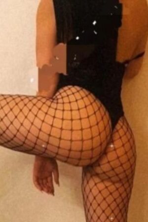 Walsall escort posing spread legged in fishnets