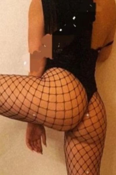 Walsall escort posing spread legged in fishnets