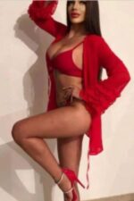 Sussex escort modelling with her knee up