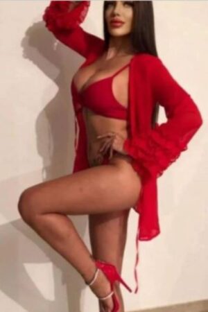 Sussex escort modelling with her knee up