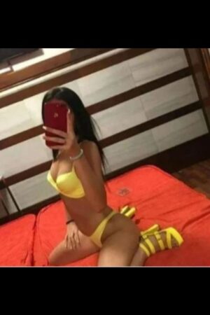 tanned Belfast escort in yellow shoes