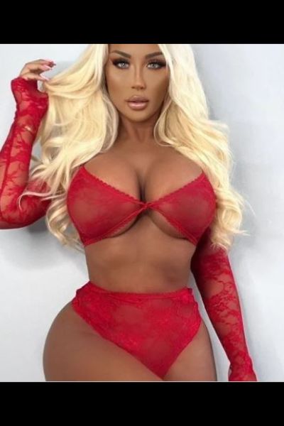 Tanned blonde Warrington escort in red lingerie