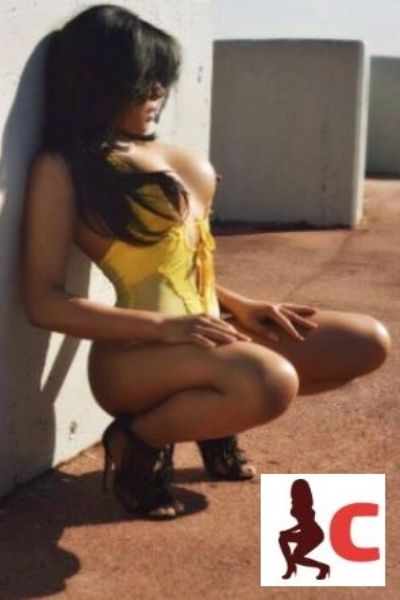 Derry escort in yellow posing outdoors