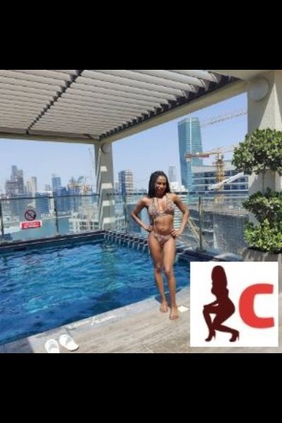 mocha Donegal escort posing by pool